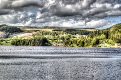 Scenic view of landscape against cloudy sky