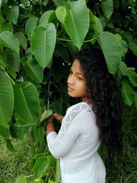 Side view of woman looking away outdoors