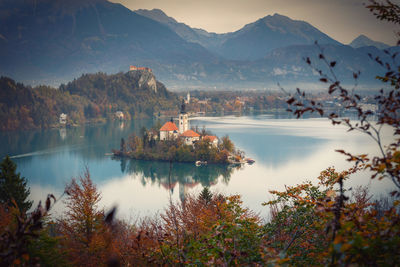 Scenic view of lake and mountains against sky