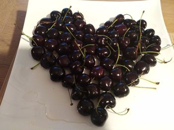 High angle view of grapes in plate on table