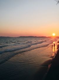 Scenic view of sea against clear sky during sunset