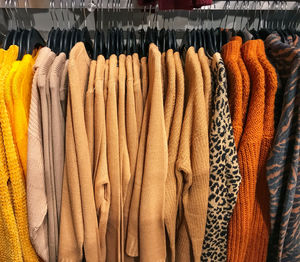 Clothes hanging on display at store