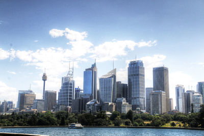 View of skyscrapers against cloudy sky