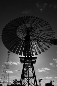 Low angle view of ferris wheel against sky