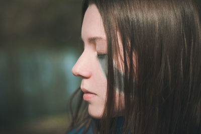 Side view of young woman