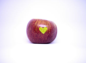 Close-up of apple against white background