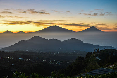 Scenic view of mountains against sky during sunset