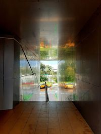 Man standing by window in building