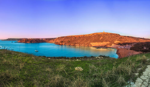 Scenic view of sea against blue sky