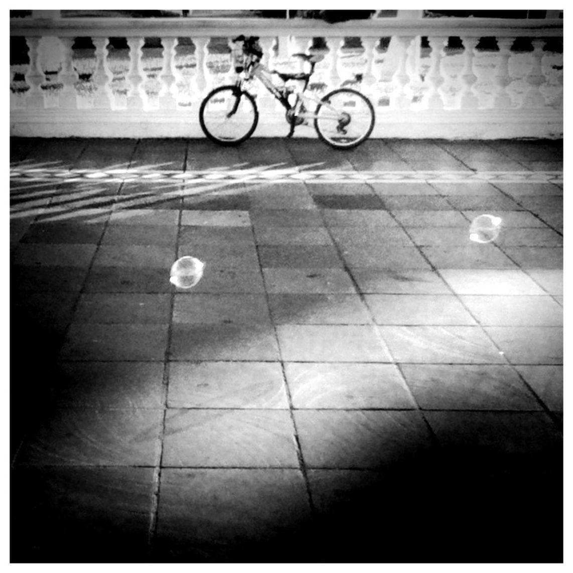 transfer print, auto post production filter, tiled floor, transportation, flooring, street, paving stone, bicycle, shadow, indoors, sidewalk, cobblestone, pavement, high angle view, empty, sunlight, reflection, travel, tile