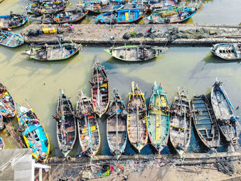 High angle view of boats moored at harbor