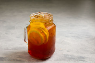 Close-up of drink in glass jar on table