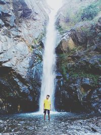 Full length of person standing on rock