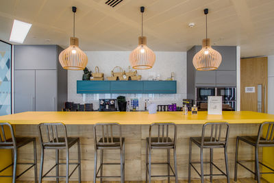 Empty chairs and tables in cafe