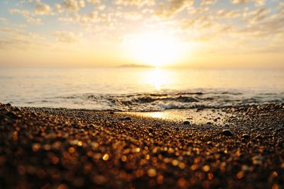Scenic view of beach at sunset