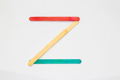 Close-up of colored pencils against white background