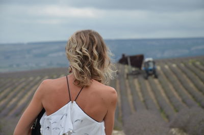 Rear view of woman looking at sea