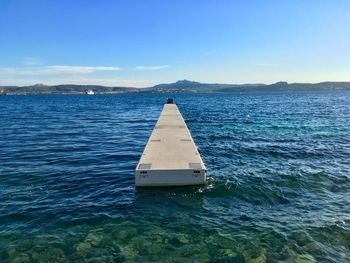 Sailboat on sea against sky