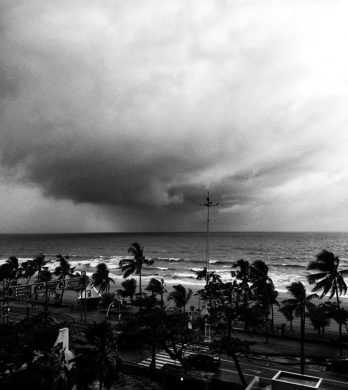 PEOPLE AT BEACH AGAINST SKY