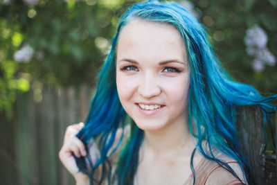 Portrait of smiling young woman outdoors