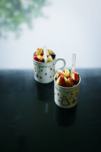 Mix fruit in the mug ,various fruit such as apple and berry