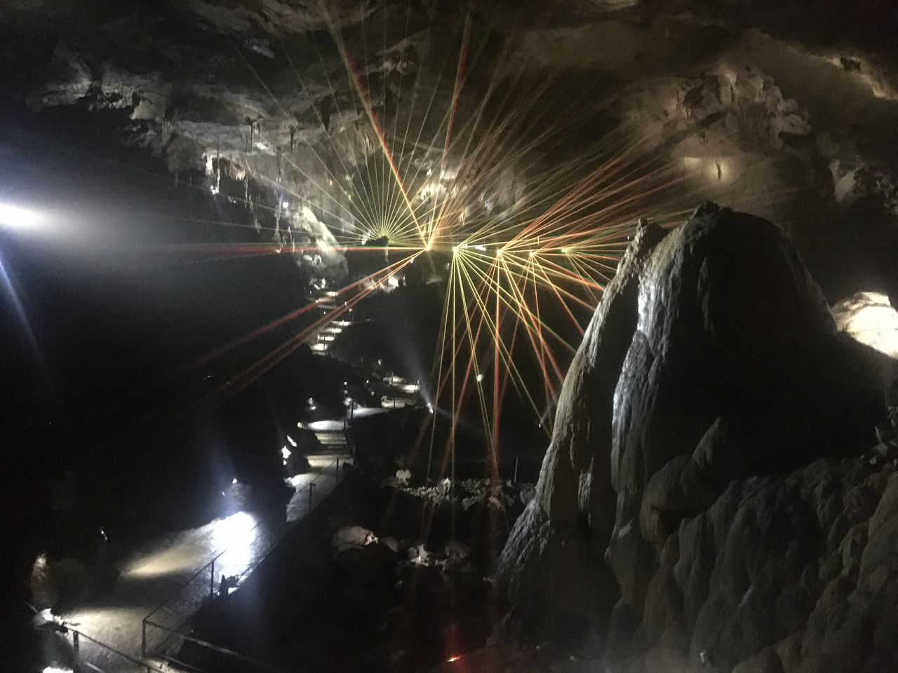 BLURRED MOTION OF FIREWORKS IN ILLUMINATED TUNNEL