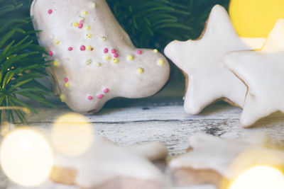 Close-up low section of white and vegetables on floor