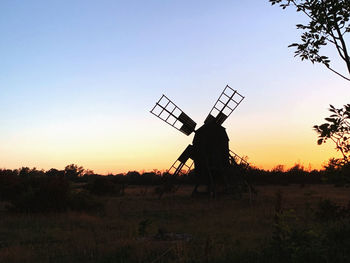 Old windmill in sunset
