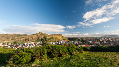 Buildings in town against sky