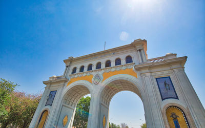 Low angle view of historical building against blue sky