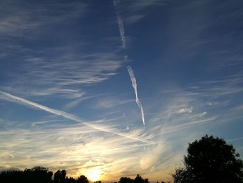 Low angle view of vapor trails in sky