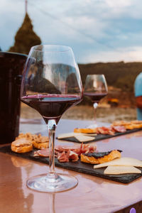 Close-up of wine in glass on table