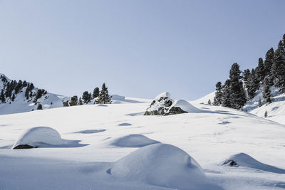 Snow covered mountain against clear sky