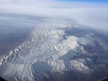 Aerial view of mountains against sky