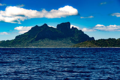 Scenic view of sea against blue sky