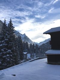 Scenic view of mountains against cloudy sky