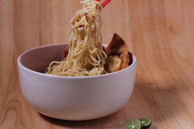 Close-up of noodles in bowl on table