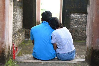 Rear view of couple sitting 