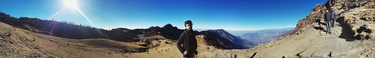 Panoramic view of mountains against clear sky