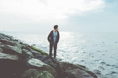 Man standing on seashore