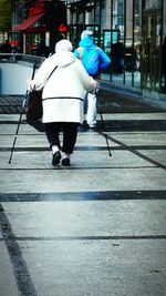 Woman walking on sidewalk