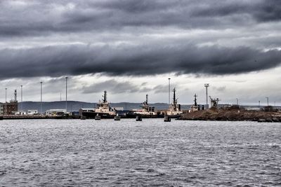 Tug boats moored in harbour