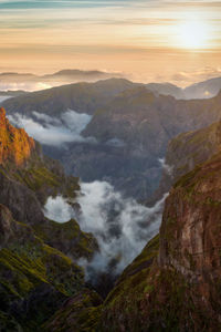 High angle view of waterfall against sky during sunset