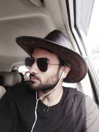 Portrait of young man wearing sunglasses