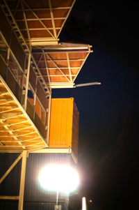 Low angle view of illuminated building at night