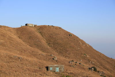 Scenic view of mountains against clear blue sky