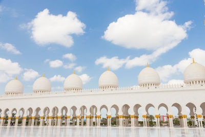 View of temple building against cloudy sky