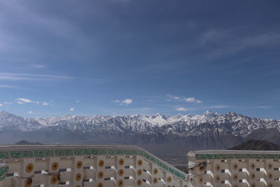 Panoramic shot of snowcapped mountains against sky