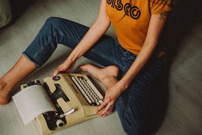 Midsection of man working in workshop