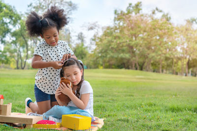 Mother and daughter on grass